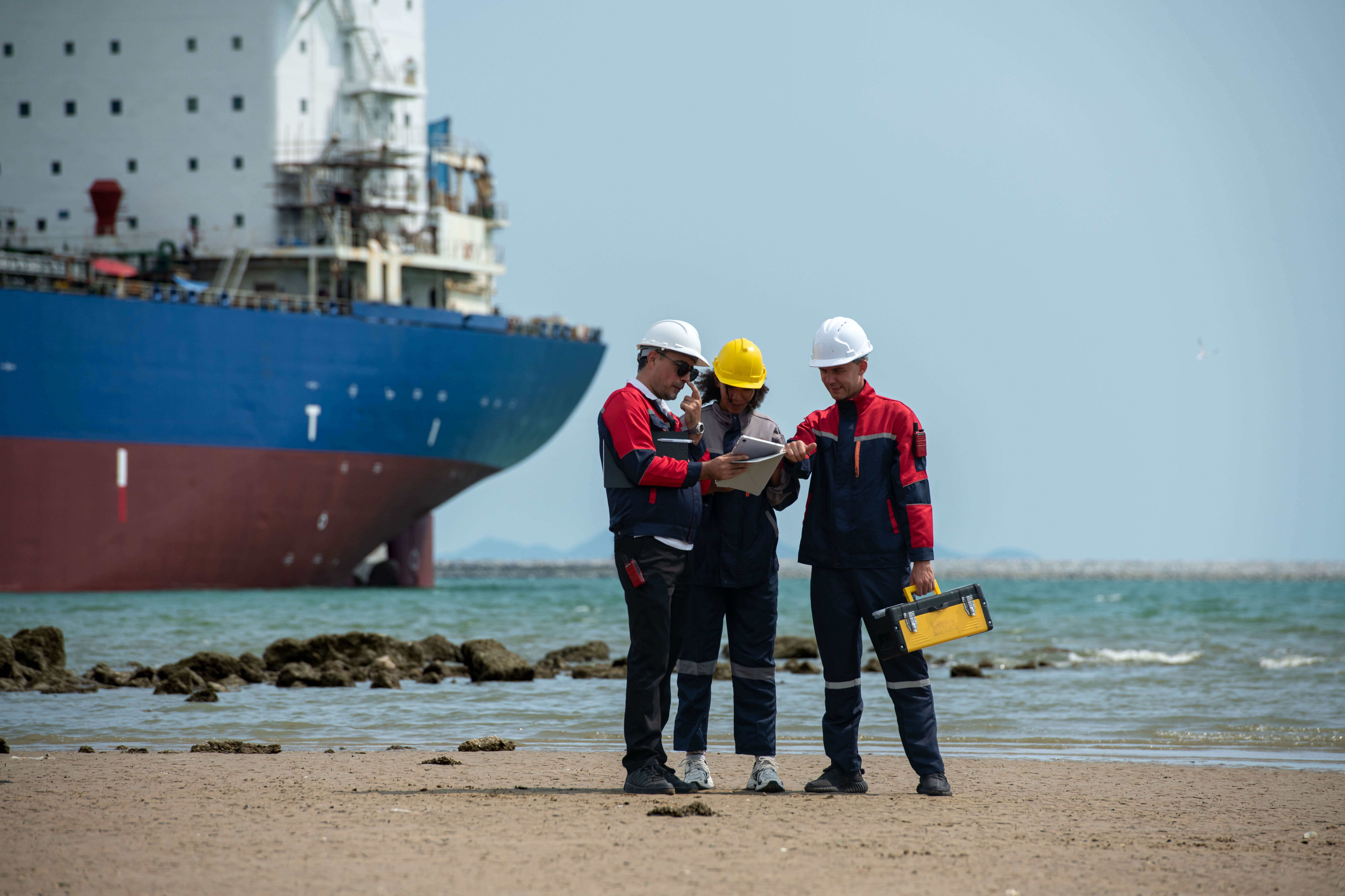 Maritime inspectors reviewing vessel compliance